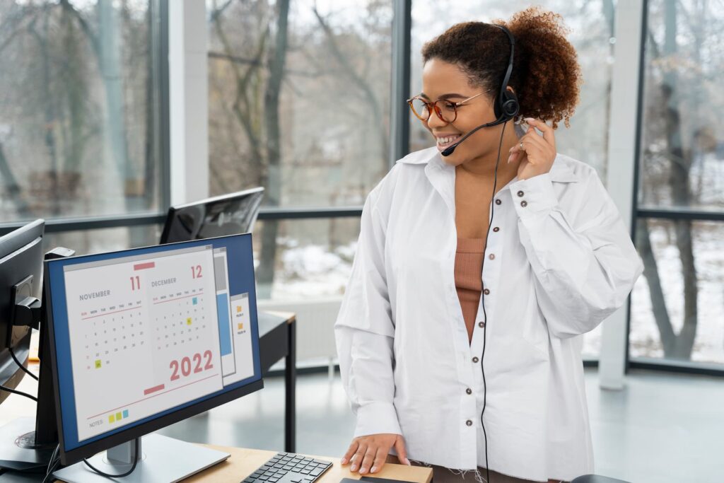 A frontdesk personnel looking through Salon Booking Software appointments.