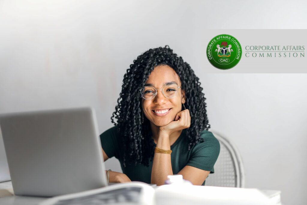A woman registering a business in Nigeria with a laptop