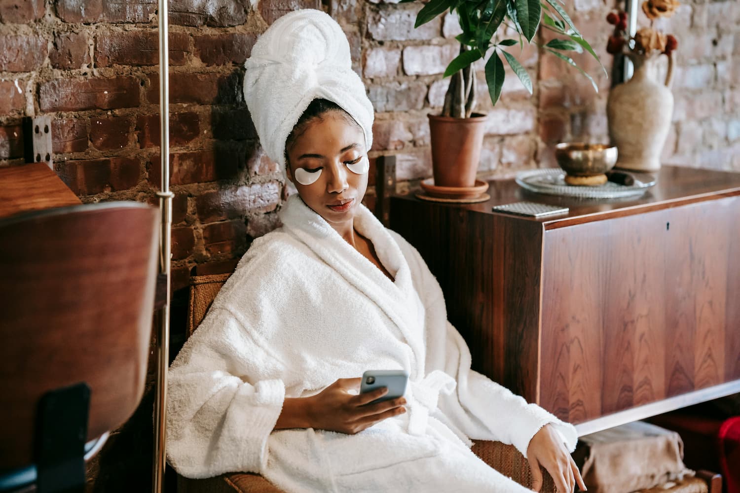 a woman looking at her phone in a spa