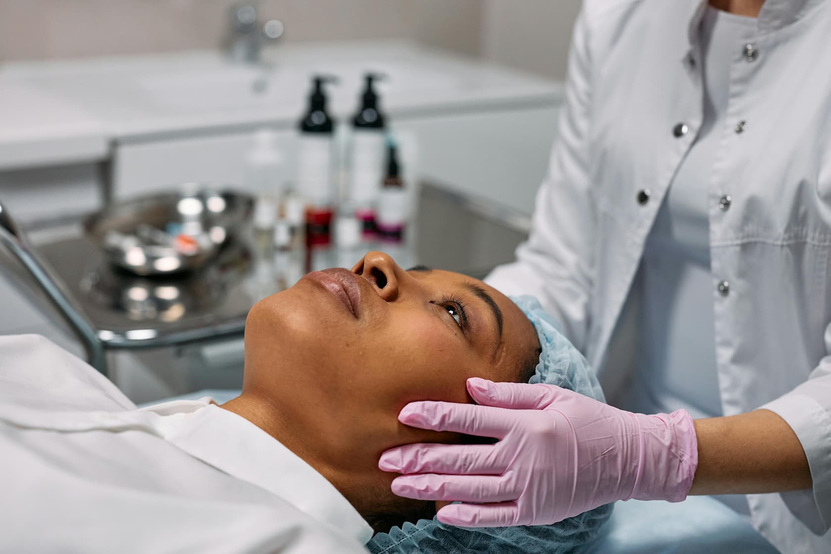referrals in beauty business / an aesthetician attending to a customer at a medspa